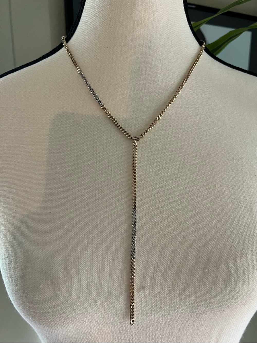 All Saints Two tone curb chain Y lariat necklace in warm gold tone and silver.